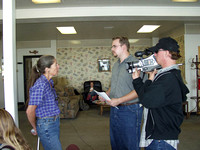 Gloria Flora speaks with a film crew after a flight over the Front in 2002