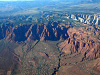 Red Mountain – Snow Canyon State Park are the white cliffs in right center – the town is Keyenta
