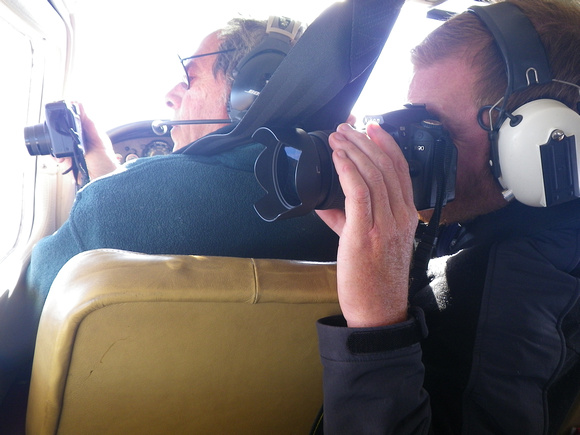 Bruce Gordon (EcoFlight Pilot) and Ray Bloxham (SUWA) shoot photographs over Utah