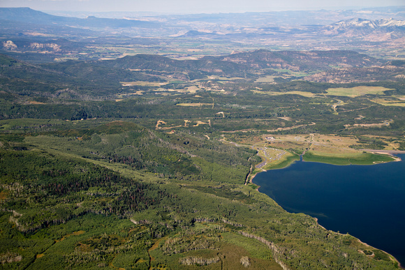 Vega Reservoir and state park; looking W; some oil/gas related development in midground