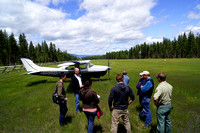 Passengers discuss forest management at Condon Airstrip